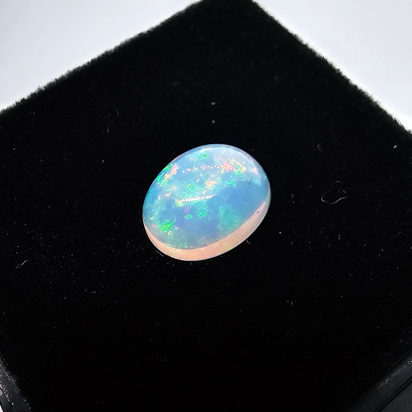 2.1 ct Oval White Opal, 10 x 8 mm